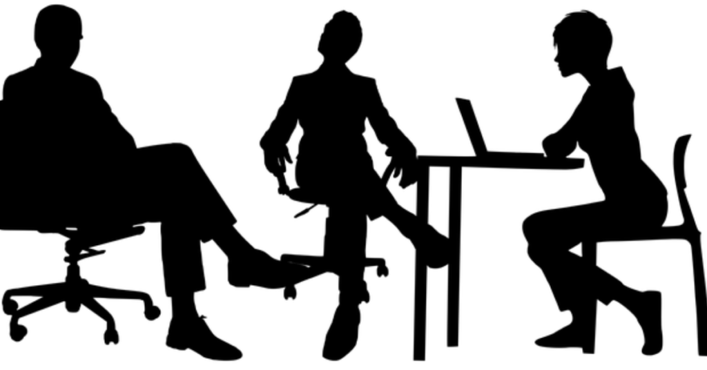 Concentric Advisors Interview Questions: A Comprehensive Guide A group of professionals conducting an interview in a modern office setting, with one candidate being interviewed by a panel of interviewers. The image conveys a formal and professional atmosphere, highlighting the interview process at Concentric Advisors.